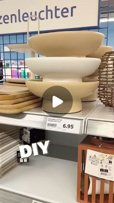 the shelves are filled with different types of plates and bowls on display in a store