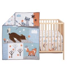 a baby crib bedding set with woodland animals