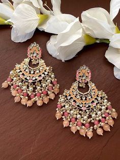 Gorgeous Pastels Jhumkas with pearl. Each piece is handcrafted . All the raw material used in this product is of high quality and is handcrafted with love. Height = 100 mm || Width = 70 mm Trendy Design Indowestern Earring 100% Satisfaction Guarantee: Long Lasting Plating, High-Quality Stones. Gifting: This pair of earrings come in a beautiful gift pack , making it an ideal gift for birthday, wedding anniversary or wedding gift. Occasion: Perfect choice for any Indian occasion. Care: It is advis Pink Chandbali Bridal Earrings Gift, Festive Pink Bridal Earrings As Gift, Festive Pink Bridal Earrings For Gifts, Pink Kundan Chandelier Earrings For Celebration, Pink Kundan Dangle Bridal Earrings, Pink Dangle Chandbalis As Gift, Bollywood Style Pink Chandelier Earrings As Gift, Bollywood Style Pink Dangle Earrings, Pink Bollywood Chandelier Earrings As Gift