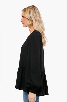 Flowy and flattering, the Carlota Peplum Blouse is a wardrobe must-have. This top features puff sleeves with elastic wrists, keyhole button back closure, high-low silhouette, and a peplum hem detail. Pair with denim and a change of accessories for a look that will take you from desk to drinks! Crew neckline Cuffed sleeves Slightly puffed sleeves High-low Peplum detail Material: 100% Polyester Care: Hand wash cold Long Sleeve Peplum Top, Chain Scarf, Tennis Tops, Fancy Party, Scarf Poncho, Monogram Styles, Peplum Hem, Peplum Blouse, Puffed Sleeves