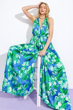 A printed woven jumpsuit featuring V halter neckline, sleeveless, self sash tie, wide leg, bare back with neck tieDetails:Self: 97% Polyester 3% SpandexLining : 100% Polyester Size & Fit- Model is 5`8" And Wearing Size Small- Measurements Taken From Size Small- Approx. Length: 63" Blue Sleeveless Tie Back Jumpsuit, Summer Halter Neck Jumpsuits And Rompers With Tie Back, Spring Green Tie Back Jumpsuits And Rompers, Spring Green Jumpsuit With Tie Back, Spring Green Jumpsuits And Rompers With Tie Back, Summer Halter Neck Jumpsuit With Tie Back, Green Backless Jumpsuits And Rompers For Summer, Blue Summer Halter Neck Jumpsuits And Rompers, Green Wide-leg Jumpsuits And Rompers For Spring