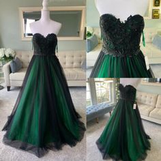 green and black prom dress on display in front of a white mannequin chair