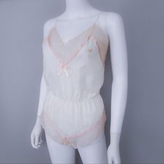 70s Vintage Lingerie Romper Soft Semi-Sheer Cotton Blend Fabric Ecru Lace Trim Pink Satin Trimmings Embroidered Dvf Logo On The Top Size Vintage "Large" {{Modern Size- Fits M-L}} Chest 36-38" Very Good Vintage Condition- Unworn Pink Feminine Camisole For Bedtime, Feminine Pink Camisole For Bedtime, Vintage Sleeveless Sleepwear For Loungewear, Vintage Sleeveless Tops For Loungewear, Pink Camisole For Daywear, Sheer Pink Camisole For Daywear, Vintage Sheer Camisole For Summer, Vintage Sleeveless Sleepwear Loungewear, Pink Coquette Camisole For Summer