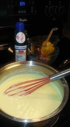 an image of batter being whisked in a pan on the stove with other ingredients