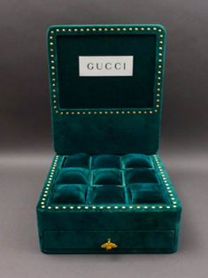 Gucci Vintage Green Velvet Watch Jewelry Store  Display Case Bee Logo
Gucci Vintage Green Velvet Watch Jewelry Store  Display Case Bee Logo With
Removable Backboard

Measures approximately 11 3/4  long, 11 3/4  wide, 18 1/4  high when open, 4
3/4  high.



Pre-owned condition. Item is being sold as found. No chips, cracks or repairs. 

Some age wear such as marks, oxidation to brass and fabric loss to right side
near drawer. Gucci Luxury Watch Accessories For Formal Occasions, Gucci Gold Watch For Gift, Luxury Round Case Watches For Gift, Luxury Round Case Watch As Gift, Luxury Round Case Watch For Gift, Luxury Gift Watches With Round Case, Rectangular Watch Accessories In Original Box For Gift, Rectangular Watch Accessories With Original Box For Gift, Rectangular Watch Accessories With Original Box For Gifting