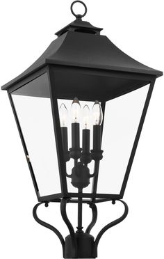 an outdoor light fixture with three lights on it's side and one light in the middle