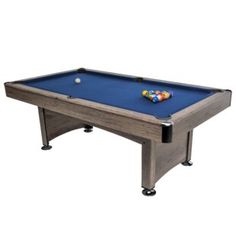 a pool table with a blue cloth on the top and two balls on the bottom