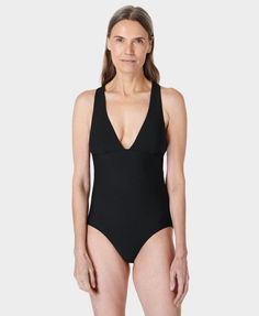 Our classic swimsuit for a streamlined performance in the pool. Part-recycled Xtra Life Lycra is 5 times more durable than elastane. Flattering V-neck silhouette with cross-back straps. Resistant to damage from chlorine and UV50+ rays. Features removable bra pads. Centre front length: 50cm / 20”. Model wears size S and is 178cm/5'10" tall. Style Code: SB9738Colour: Black Second-skin V-neck Swimwear, Elastane Swimwear With Moderate Back Coverage And 4-way Stretch, 4-way Stretch Swimwear With Moderate Back Coverage, Moderate Back Coverage 4-way Stretch Swimwear, Compressive Solid One-piece Swimwear, Classic Sleeveless Swimwear For Summer, Classic Summer Swimwear, Fitted Sleeveless Classic Swimwear, Classic Sleeveless Summer Swimwear