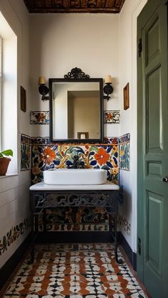 a bathroom with a sink, mirror and tiled flooring in front of a green door