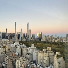 an aerial view of the city skyline at sunset