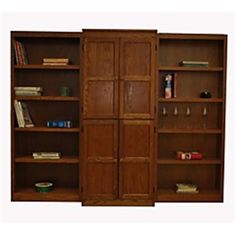 two wooden bookshelves with wine glasses on them