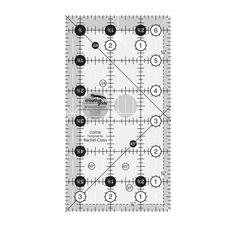 a ruler that is on top of a piece of paper with circles and dots in it