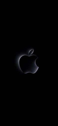 an apple logo is shown in the dark