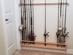 there are many fishing rods hanging on the wall