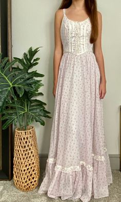 "Gunne Sax by Jessica McClintock Size XS Light baby lavender background with dainty floral print Thin shoulder straps Lace up front Fully lined Full maxi length Attached waist ties Satin and lace trim Vintage size 5, which is a modern 0 Bust is ideal for 30-32\" Waist 22\" Length 56\" Model wears a size 0 and is 5'3\" For reference" Vintage Dresses Plus Size, Gunne Sax Prairie Dress, Gunne Sax Dress Pattern Free, 70s Gunne Sax Dresses, Prairie Dress Modern, 70 Style Outfits 70s Fashion, Gunnie Sax Dress, Gunne Sax Dress Vintage 70s, Gunne Sax Dress Pattern