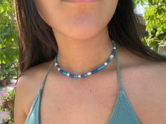 Dainty Surfer summer choker, beaded choker necklace, blue choker for women, surfer jewerly gift for women Dainty Surfer choker necklace style in blue color, with gold plated brass beads, white shell beads and polymer clay beads. In this list the choker is in blue color but is avalaible in other colors at my store. The diammeter of the beads is 4mm and the lenght of the choker is 35cms + 5 cms of extra chain. These simple, delicate and versatil choker that you can wear at any occassion. Confortab Beachy Blue Beaded Necklaces For Vacation, Blue Beaded Necklace For Beach Vacation, Blue Beachy Beaded Necklace For Vacation, Summer Turquoise Choker With Colorful Beads, Beachy Blue Beaded Necklace For Vacation, Trendy Blue Choker With Tiny Beads, Trendy Blue Choker With Colorful Beads, Blue Tiny Beads Choker For Summer, Casual Blue Beaded Choker