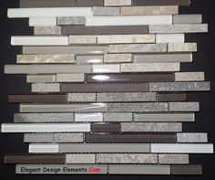 a wall made up of different types of glass and stone tiles, with the words elegant design elements com on it