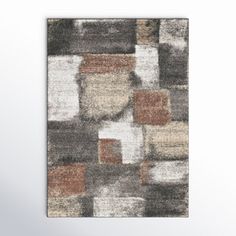 an area rug with various colored squares on it