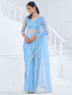 This saree is crafted from luxurious organza material in a captivating sky-blue color with intricate Swarovski work all over. The saree is adorned with a heavy handwork border, adding a touch of sophistication and elegance to the overall look. Paired with a matching organza blouse featuring zircon work, this ensemble is perfect for receptions, parties, festivals, or any special occasion.
This saree includes its gorgeous sky-blue color that exudes charm and elegance. The Swarovski work all over t Light Blue Saree, Organza Saree With Blouse, Shimmer Saree, Lehenga Crop Top, Stitched Saree, Powder Blue Color, Lehenga Choli Wedding, Floral Lehenga, Party Wear Lehenga Choli