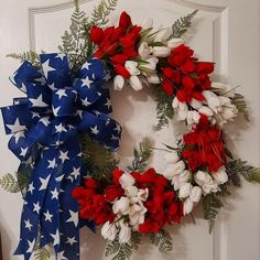 a wreath with red, white and blue flowers