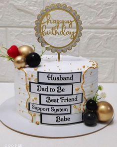 a birthday cake with gold and black decorations on the top that says, husband dad to be best friend support system babe