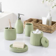 bathroom accessories including soap dispenser, toothbrush holder and tissue dispenser