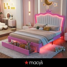 a bed that has some lights on the headboard and foot board in front of it