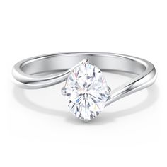 a white gold ring with a round cut diamond