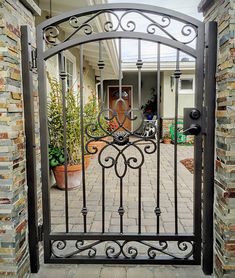 an iron gate in front of a house