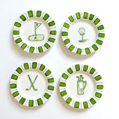 four green and white plates with golf designs on them