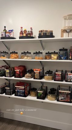 the shelves are filled with various foods and condiments