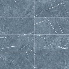 marble tiles in different shades of blue and grey with white lines on the top, bottom, and bottom