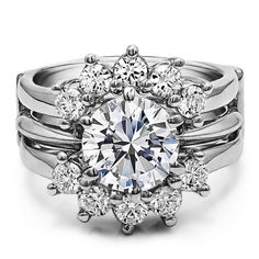 a white diamond ring with three rows of diamonds on top and bottom, surrounded by smaller round