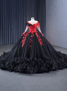 Whirlwind romance awaits in this captivating prom gown! Its bodice, a work of art, features a dramatic red floral lace that blooms passionately against the midnight-black background. The off-the-shoulder sheer sleeves whisper tales of elegance, flowing seamlessly into a heart-shaped neckline that frames the face with grace. The voluminous black tulle skirt, dusted with a constellation of sequins, swirls with every movement, making it impossible not to take center stage. Red appliqués trail down Quinceanera Red And Black, Red And Black Quinceanera, Black And Red Wedding Ideas, Tulle Skirt Black, Sparkle Skirt, Blue Ball Gowns, Fall Trends Outfits, Appliques, Black Tulle