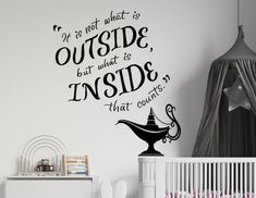 a child's room with a wall decal that says if not what is outside, but what is inside