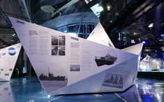 an exhibit with several different types of boats on display