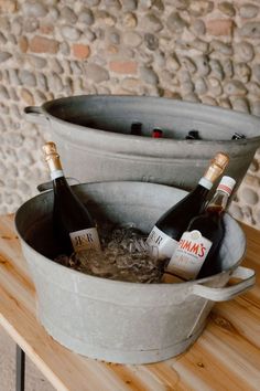 This shows a drinks display with two large galvanised baths. In the baths is iced water and bottles of alcohol. Welcome Drink Station, Iced Water, Drink Display, Barn Photography, Barrel Bar, Bar Display, Event Bar, Drinks Trolley, Classic Bar