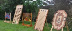 an assortment of wooden games in the grass