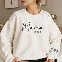 Personalized Mama Sweatshirt, Mama Est Crewneck Sweatshirt, Unisex Sweatshirt, Womens Fall Winter Sweatshirt, Kids Names Sleeve Sweatshirt by WINDINGTRAILDESIGNCo on Etsy Crew Neck Cotton Hoodie With Name Print, White Sweatshirt With Name Print, Relaxed Fit, White Sweatshirt With Name Print And Relaxed Fit, Relaxed Fit White Sweatshirt With Name Print, Winter Name Print Relaxed Fit Sweatshirt, Winter Sweatshirt With Name Print In Relaxed Fit, White Sweater With Name Print For Fall, White Crew Neck Sweater With Name Print, White Cotton Sweater With Name Print