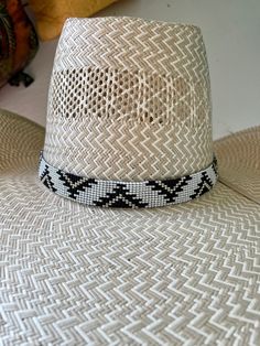 ".75\" wide All bead work is beaded with 10lb extreme braided nylon line. All hat bands are finished at 23\" with glued than sewed down leather ends and an adjustable leather tie." Aztec Hat, Beaded Headbands, Black And White Hats, Black And White Aztec, Diy Bracelets With String, Beaded Hat Bands, Beading Loom, Band Ideas, Beaded Stuff