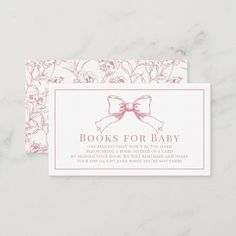 a pink and white business card with a bow on it