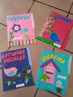 four children's books are sitting on the floor with their name written in spanish