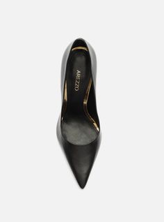 Black pump. The style features a high stiletto heel and a pointed toe. It is closed with a rounded cutout on the upper over the instep, and a snug fit on the sides. With an insole in the same color as the sandal and the brand name engraved, it shows the instep. Why follow this trend? The iconic Emily High Stiletto Pump lengthens the leg and boosts your confidence with each powerful stride. The ultra-luxe leather and the pointed toe exude effortless sophistication. Get ready to fall in love with