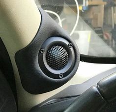 the inside of a car with speakers in it