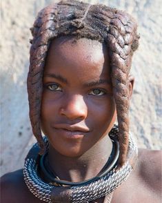 an african woman with braids on her head