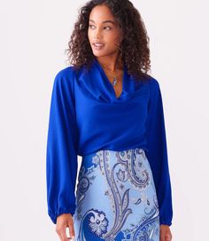 This stunning top in a striking blue color, exudes modern elegance with its luxurious moss crepe fabric that drapes gracefully and flatters the figure. With a sophisticated cowl neck, this top is suitable for both formal and casual occasions. Color- Royal blue. Cowl neck. Blouson sleeves. Elasticized cuffs. Fabric - Moss Crepe: 100% Polyester. Bohemian Chic Outfits, Stunning Tops, Boho Chic Outfits, Cowl Neck Top, Karen Kane, Japanese Fabric, Draped Fabric, Boho Women, Crepe Fabric