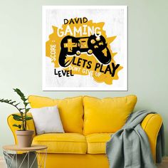 a living room with a yellow couch and a painting on the wall that says david gaming lets play