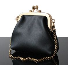 This Small Black handbag in soft real leather with Golden frame kisslock made in France. This purse is unique creation of Our collection of Wedding purse and Evening bags. Only a real leather and genuine leather and 100% handmade wormanship. The Evening bag  with clasp from the Olga's Luxury Creation are more than a singular wallet, you can use as a makeup bag ! Some Evening bag  or wallet are can also used as a small pouch.  You will enjoy quality materials (genuine leather, real leather, wool, Luxury Pouch Bags For Evening, Evening Bags Clutch Fabric, Luxury Evening Bags With Leather Strap, Luxury Elegant Clutch Shoulder Bag, Luxury Leather Shoulder Evening Bag, Handmade Luxury Evening Bag, Luxury Elegant Handmade Shoulder Bag, Luxury Trendy Evening Bag, Luxury Trendy Evening Wallets