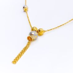 This fancy 22k gold necklace features a striking multi-color design, blending yellow and white gold for a unique and elegant look. Weighing 9.1 grams, it offers a luxurious yet comfortable feel. The radiant combination of yellow and white gold enhances its modern and sophisticated appeal. With a necklace length of 18 inches and a drop length of 1.5 inches, this piece is perfect for adding a touch of refined style to any outfit. The secure lobster lock ensures confident and comfortable wear. Elev Elegant Multicolor 22k Gold Necklaces, Dual-tone Gold Plated Necklace, Gold Dual-tone Necklace For Gift, Dual-tone Gold Necklace For Gift, Elegant Multicolor Dual-tone Necklaces, Elegant Multicolor Dual-tone Necklace, Dual-tone 22k Yellow Gold Necklaces, 22k Dual-tone Yellow Gold Necklaces, Elegant Gold Dual-tone Necklace