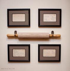 four framed photographs and a baseball bat hanging on a wall with writing in black frames